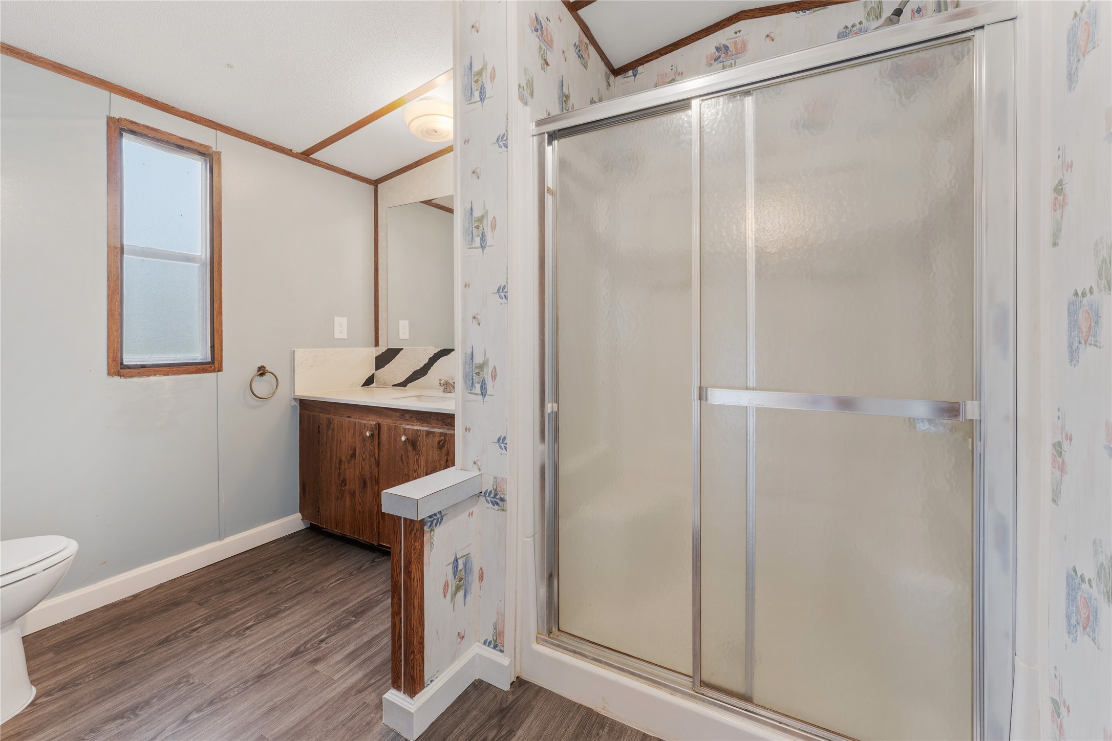 21504 Mexican John Road, Unit C New Caney, TX 77357 - Photo 6 of 15 a view of a room with wooden floor and cabinet