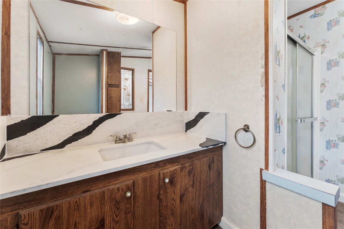 21504 Mexican John Road, Unit C New Caney, TX 77357 - Photo 7 of 15 a bathroom with a sink and a mirror
