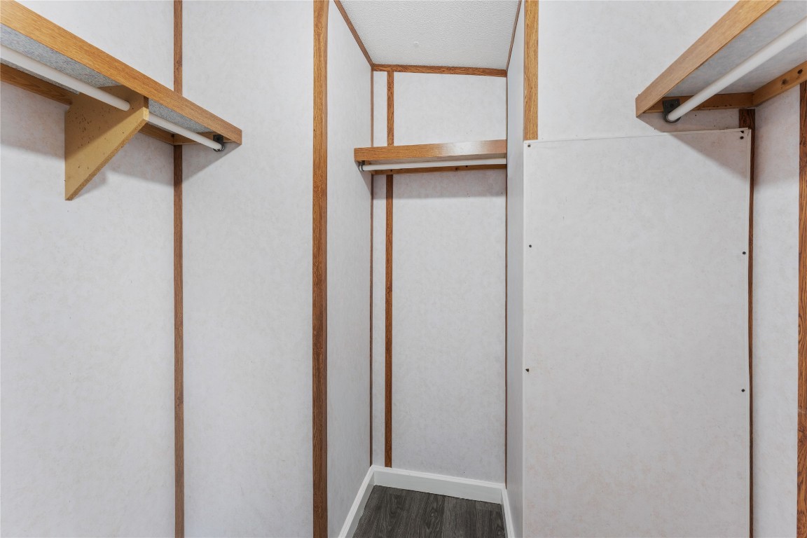 21504 Mexican John Road, Unit C New Caney, TX 77357 - Photo 9 of 15 a view of walk in closet with clothes