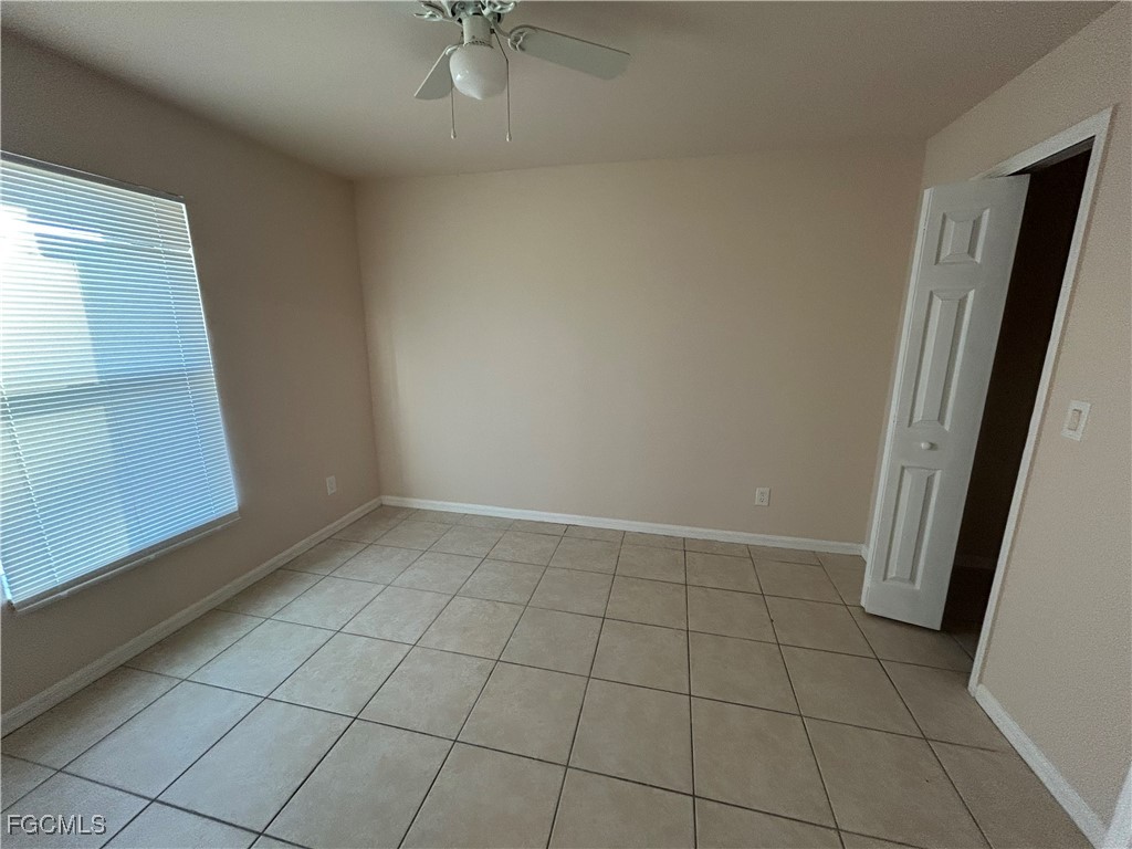 3719 32nd Street Southwest Lehigh Acres, FL 33976 - Photo 12 of 15 a view of an empty room and window