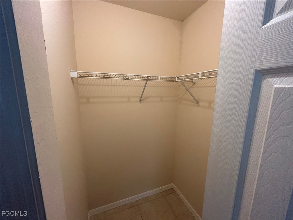 3719 32nd Street Southwest Lehigh Acres, FL 33976 - Photo 13 of 15 a view of small space with racks on the wall