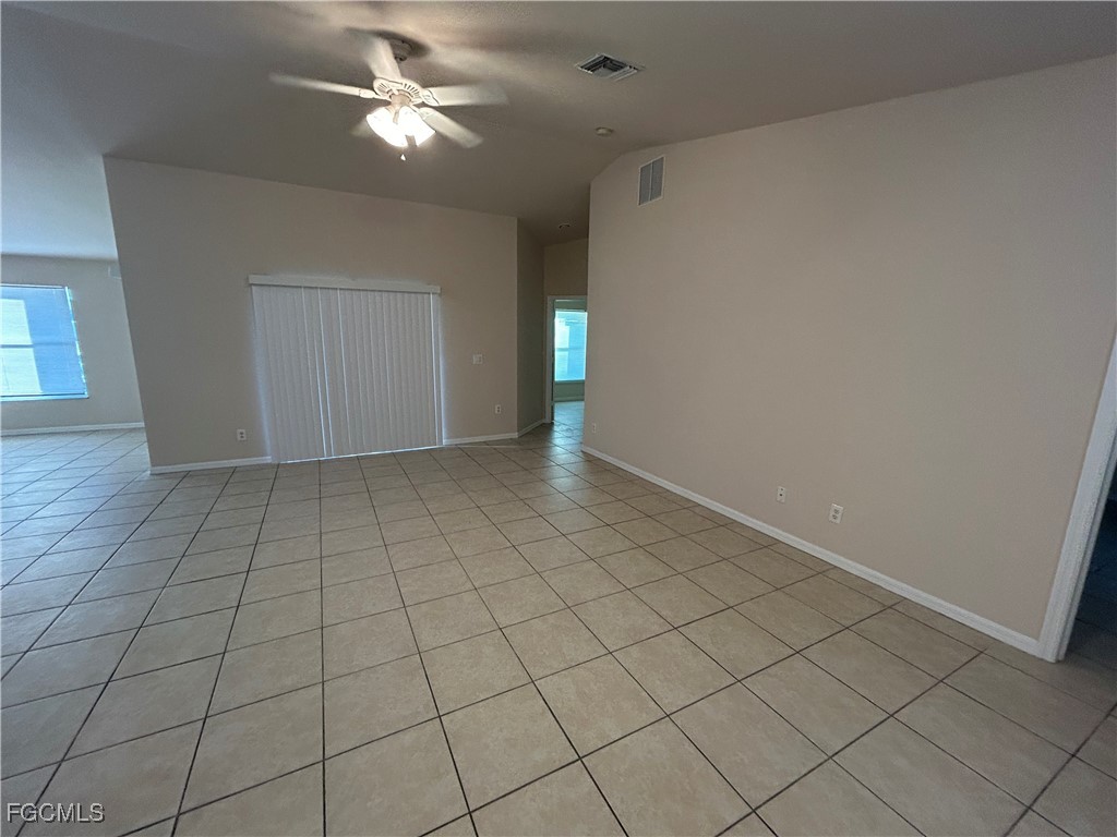 3719 32nd Street Southwest Lehigh Acres, FL 33976 - Photo 4 of 15 a view of an empty room and chandelier fan