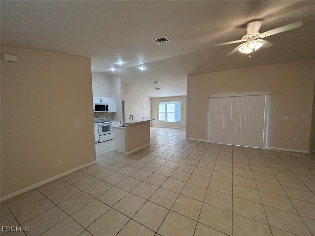 3719 32nd Street Southwest Lehigh Acres, FL 33976 - Photo 5 of 15 a view of kitchen and window