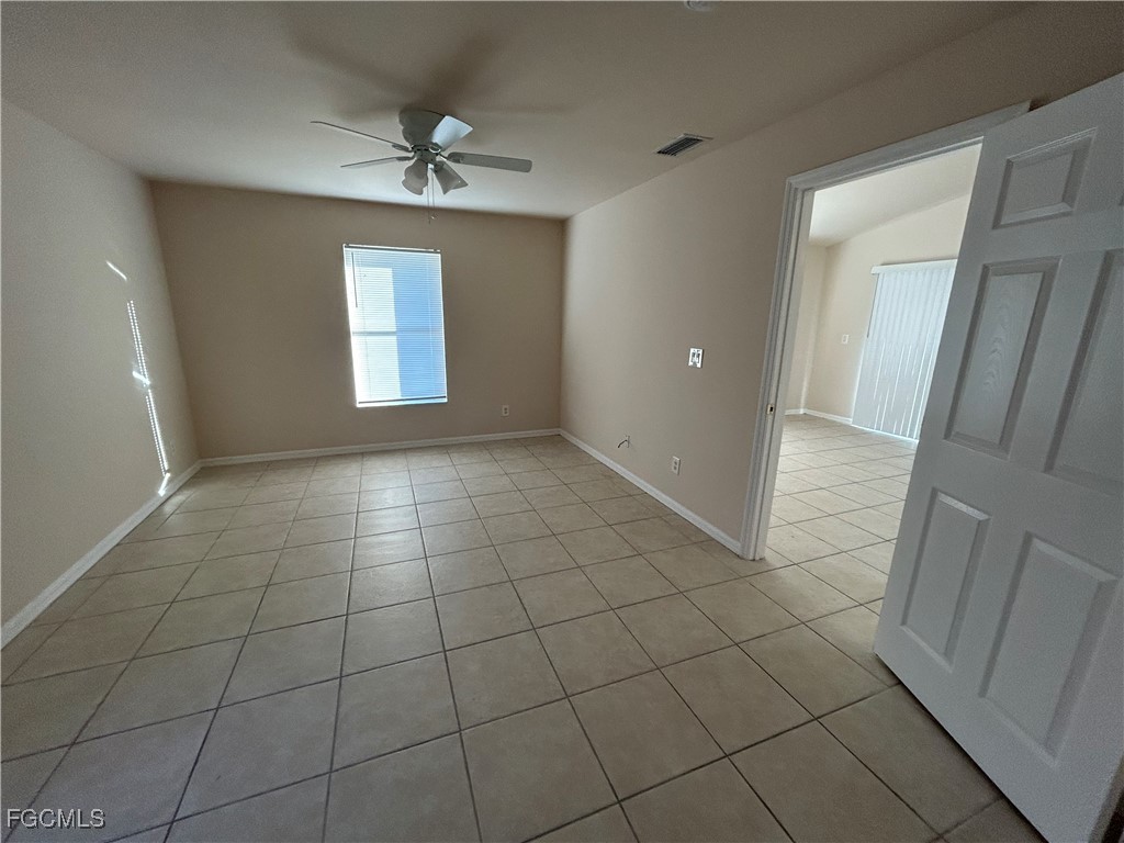 3719 32nd Street Southwest Lehigh Acres, FL 33976 - Photo 8 of 15 a view of an empty room and a window