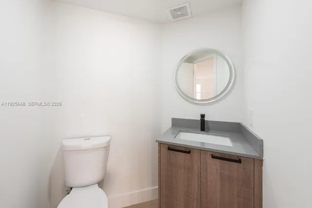 an aerial view of multiple houses with yard