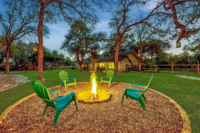 a view of a backyard with sitting area