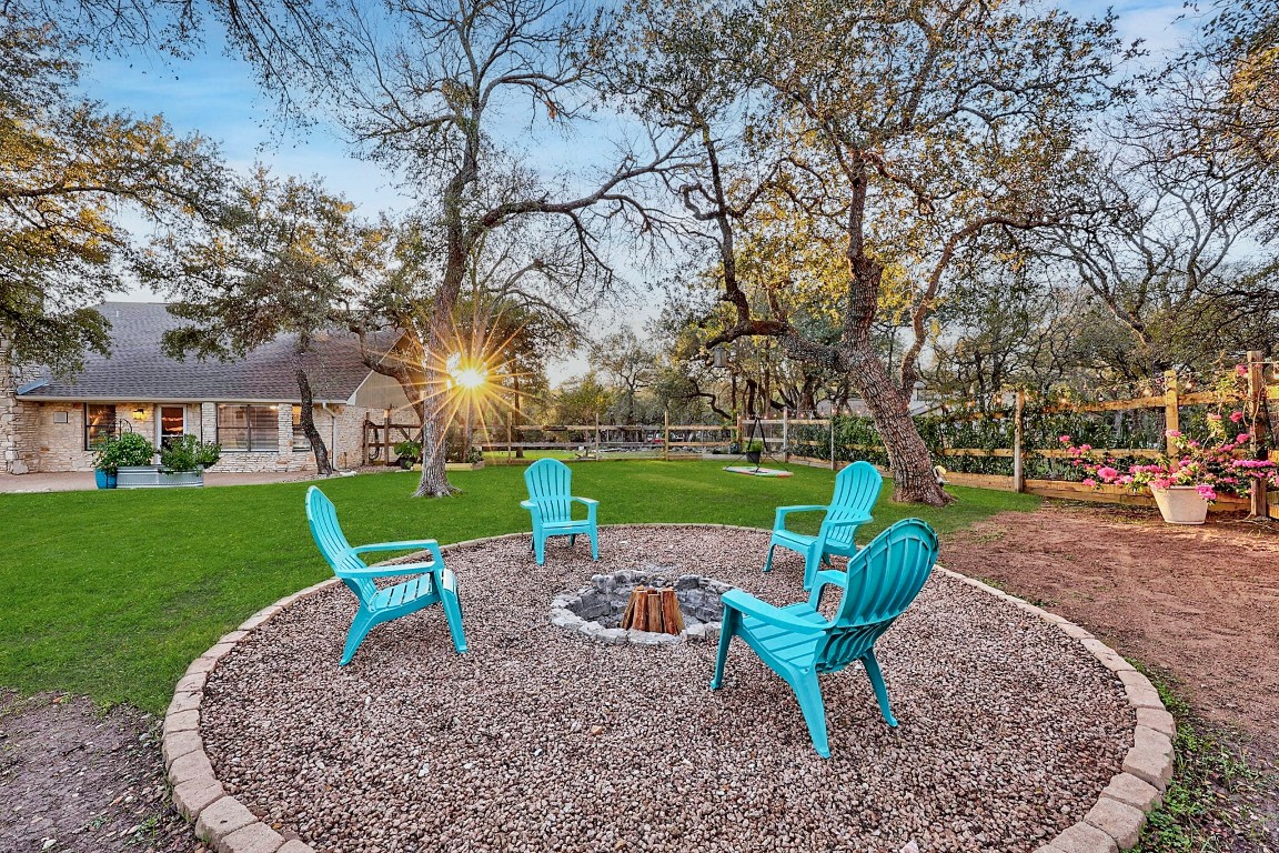 4203 Azul Court Georgetown, TX 78628 - Photo 11 of 38 a view of a garden with a bench in a park