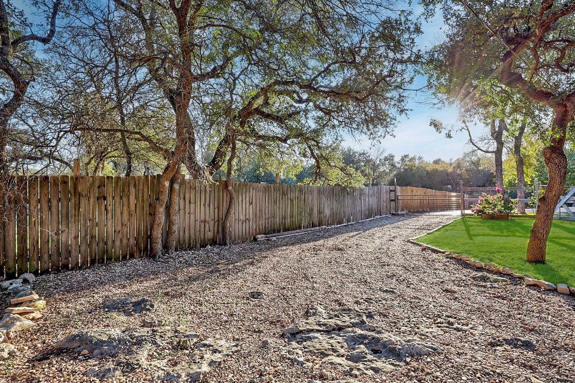 4203 Azul Court Georgetown, TX 78628 - Photo 12 of 38 a backyard of a house with lots of green space