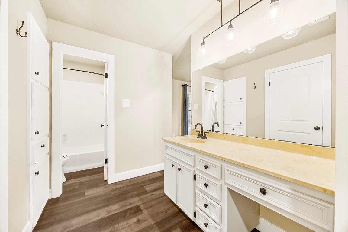 4203 Azul Court Georgetown, TX 78628 - Photo 24 of 38 a spacious bathroom with a granite countertop sink mirror and a