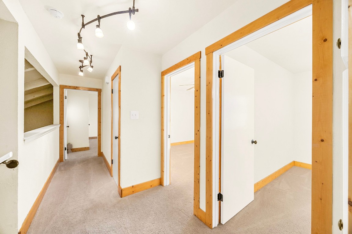 4203 Azul Court Georgetown, TX 78628 - Photo 26 of 38 a view of a hallway with wooden floor and cabinet
