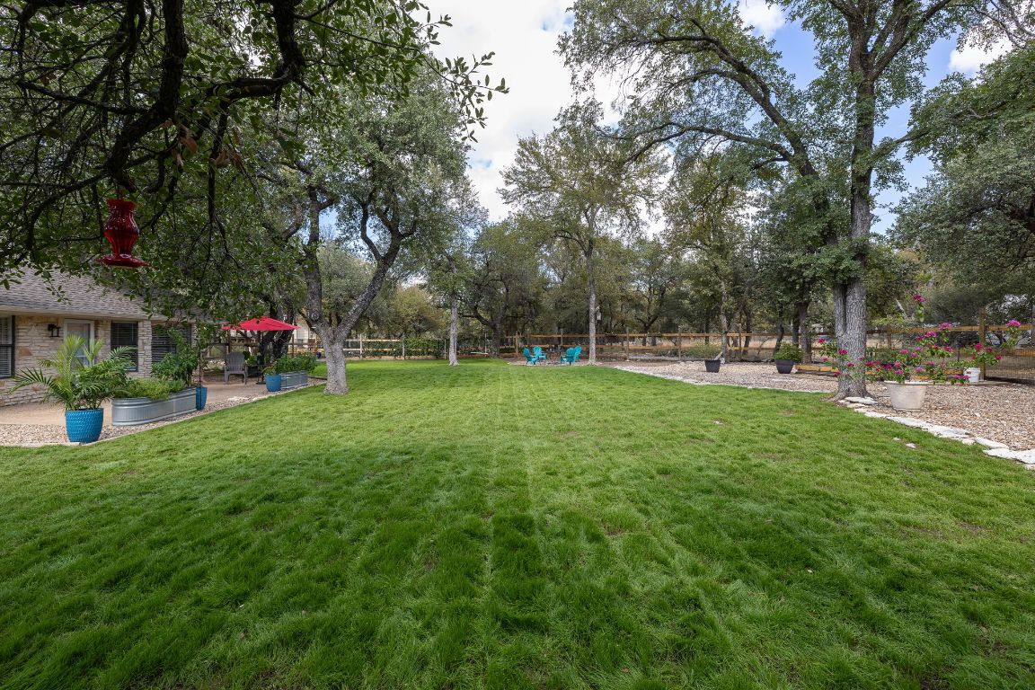 4203 Azul Court Georgetown, TX 78628 - Photo 33 of 38 a view of a park with swings and slides