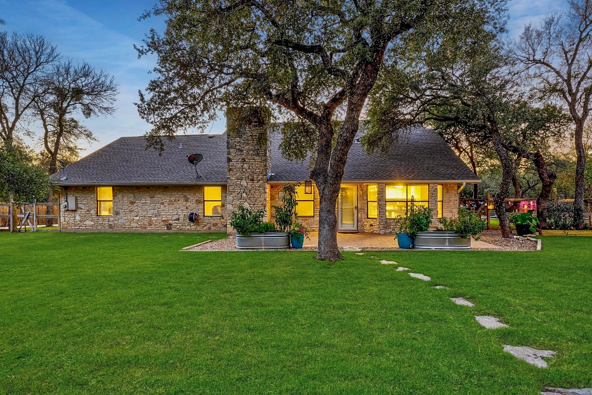 4203 Azul Court Georgetown, TX 78628 - Photo 6 of 38 a view of a house with a big yard and large trees