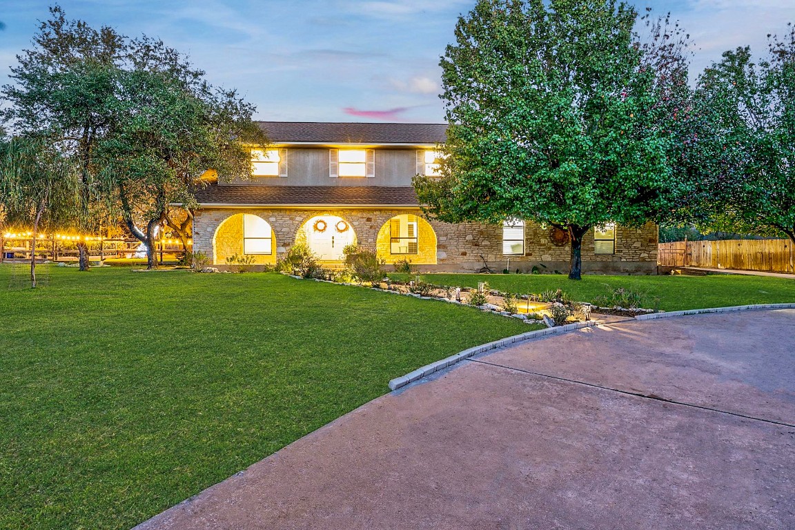 4203 Azul Court Georgetown, TX 78628 - Photo 7 of 38 a view of a house with a big yard and large trees