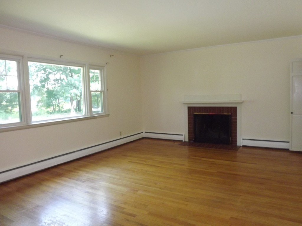 107 Sherwood Road Springfield, MA 01119 - Photo 8 of 17 an empty room with a fireplace