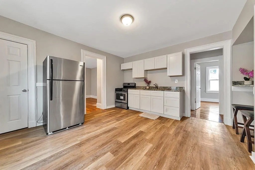 47-49 Howes Street Springfield, MA 01118 - Photo 4 of 11 a kitchen with a refrigerator and a sink