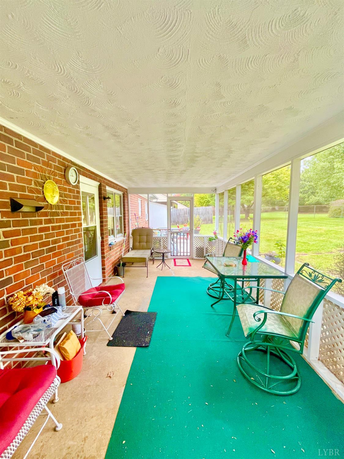 4316 Montgomery Road Lynchburg, VA 24503 - Photo 15 of 19 a backyard of a house with seating space