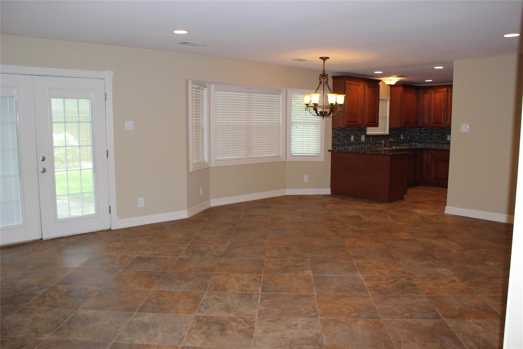 10301 Ivyridge Road Houston, TX 77043 - Photo 13 of 23 Den with doors to backyard