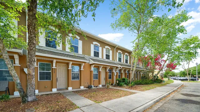 a view of a brick building next to a yard