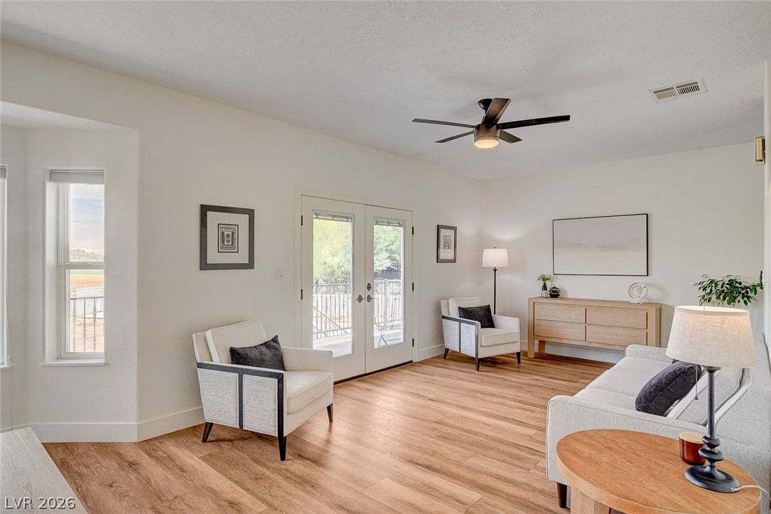 4362 Thistle Street Logandale, NV 89021 - Photo 12 of 99 LVP floors and generous natural light create an inviting atmosphere.