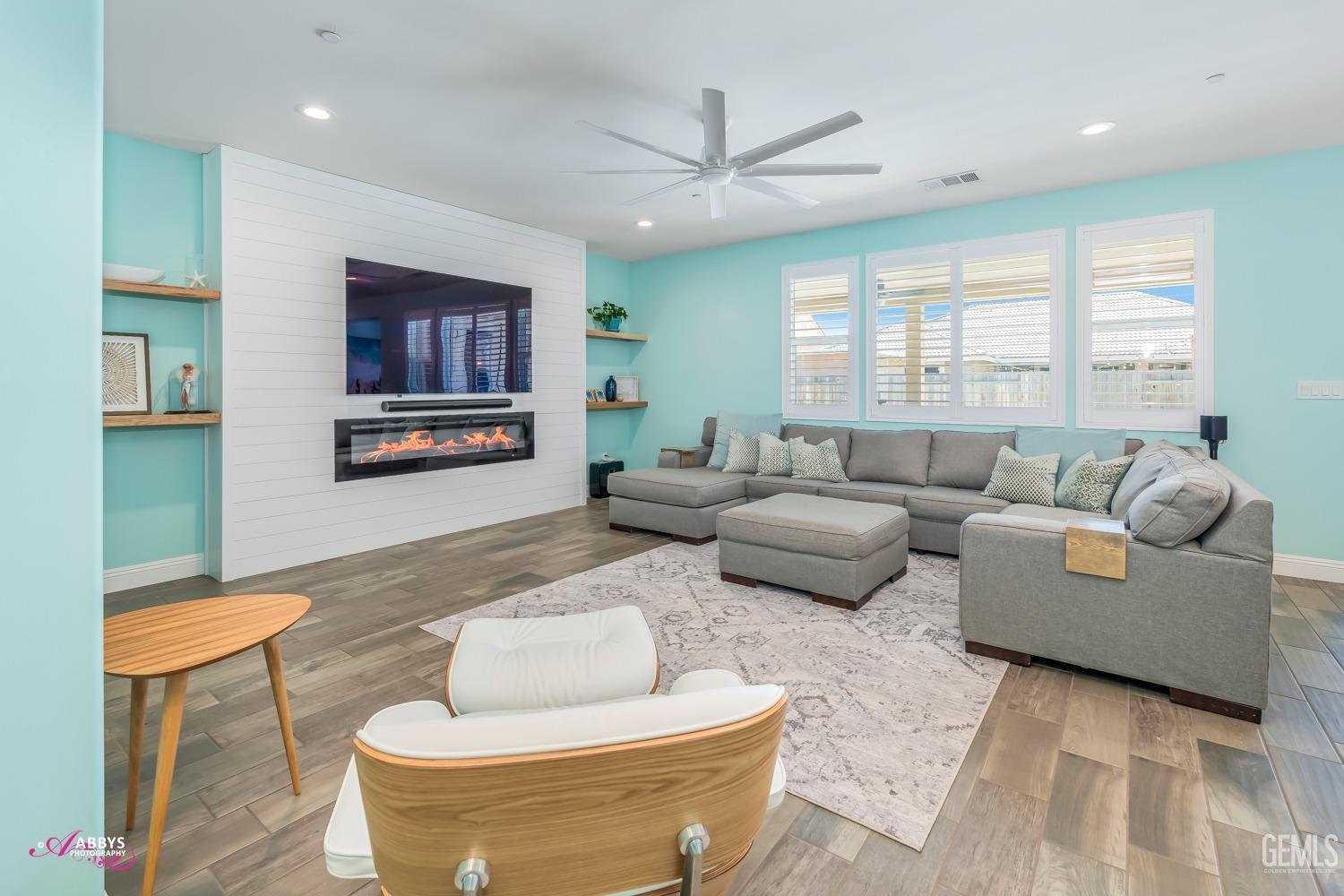 Undisclosed Address Bakersfield, CA 93314 - Photo 13 of 40 a living room with furniture and a flat screen tv