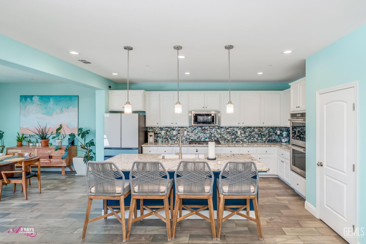 Undisclosed Address Bakersfield, CA 93314 - Photo 19 of 40 a kitchen with a table and chairs