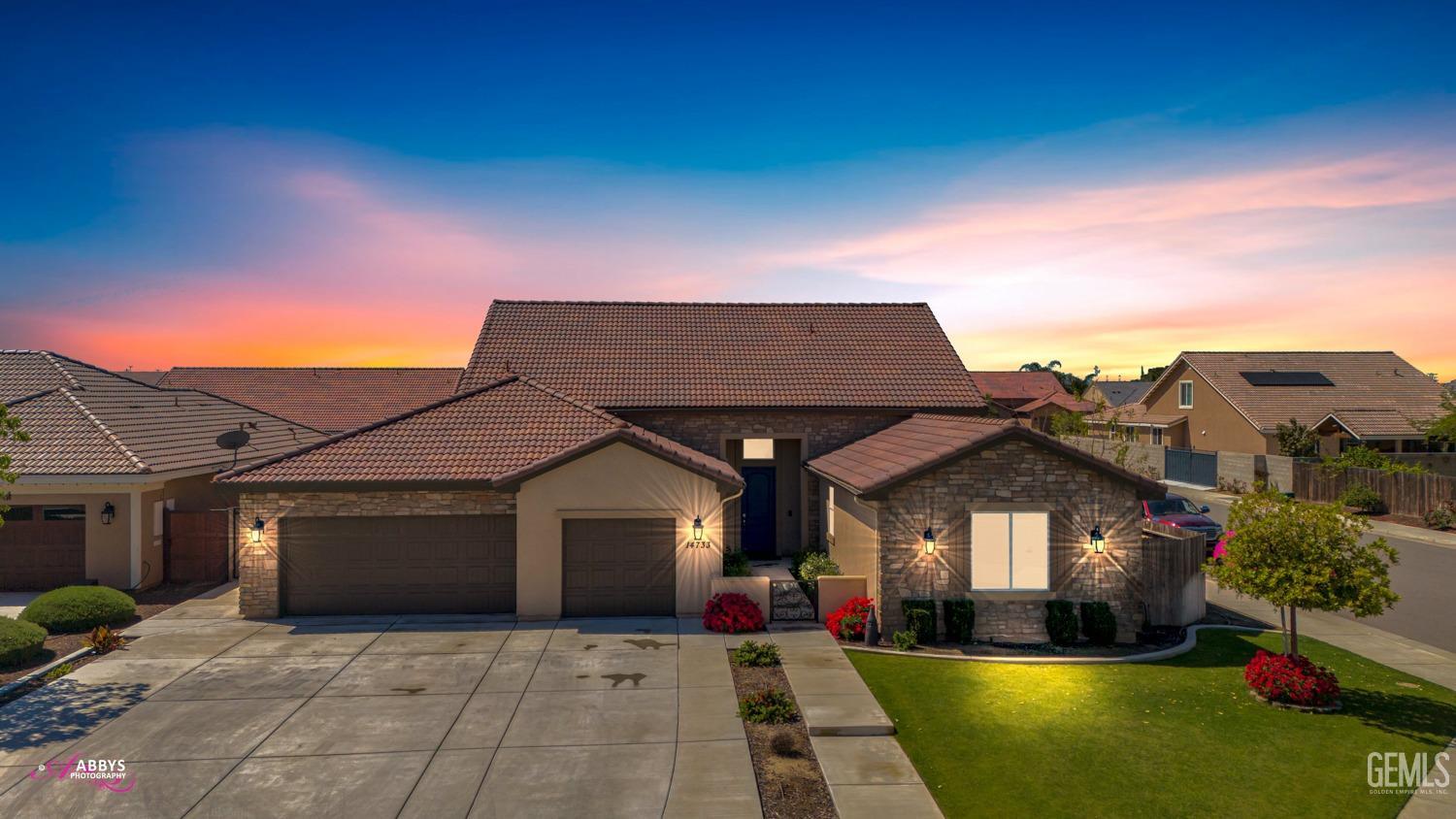 Undisclosed Address Bakersfield, CA 93314 - Photo 2 of 40 a front view of a house with yard