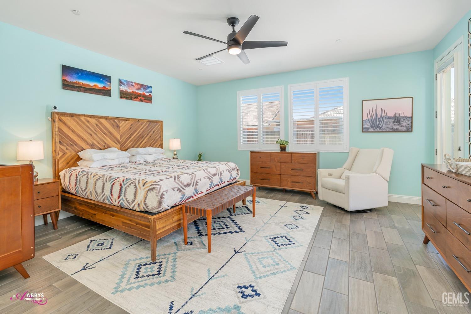 Undisclosed Address Bakersfield, CA 93314 - Photo 22 of 40 a bedroom with a bed and a chandelier