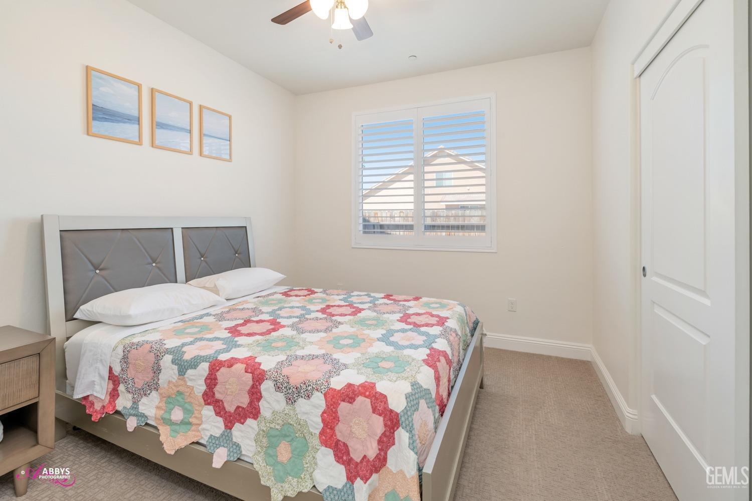 Undisclosed Address Bakersfield, CA 93314 - Photo 26 of 40 a bedroom with a bed and a window
