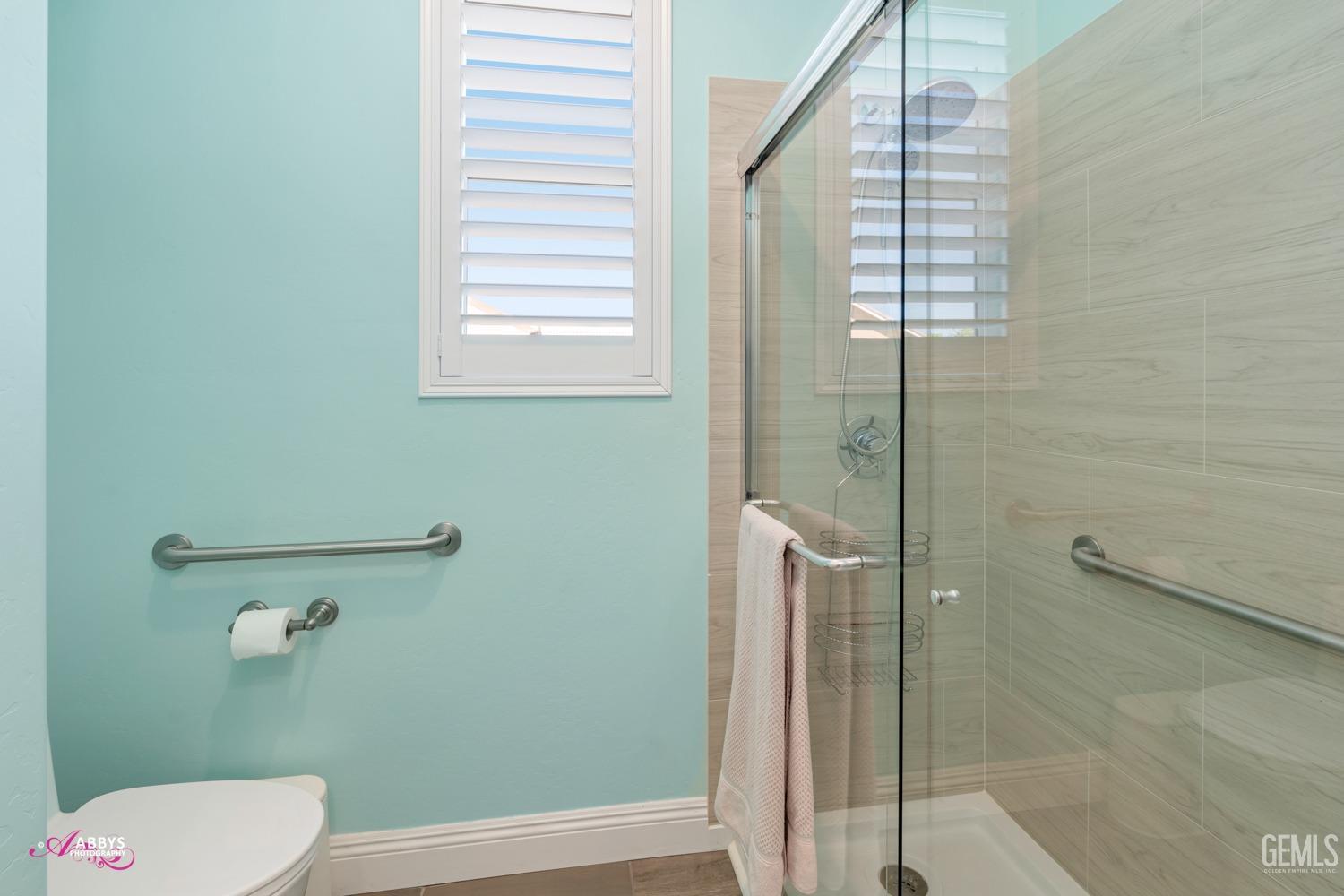 Undisclosed Address Bakersfield, CA 93314 - Photo 28 of 40 a bathroom with a toilet and a shower