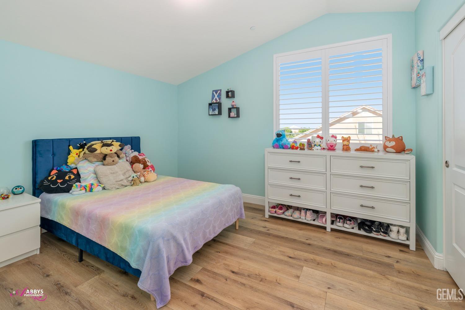 Undisclosed Address Bakersfield, CA 93314 - Photo 30 of 40 a bedroom with a bed and window