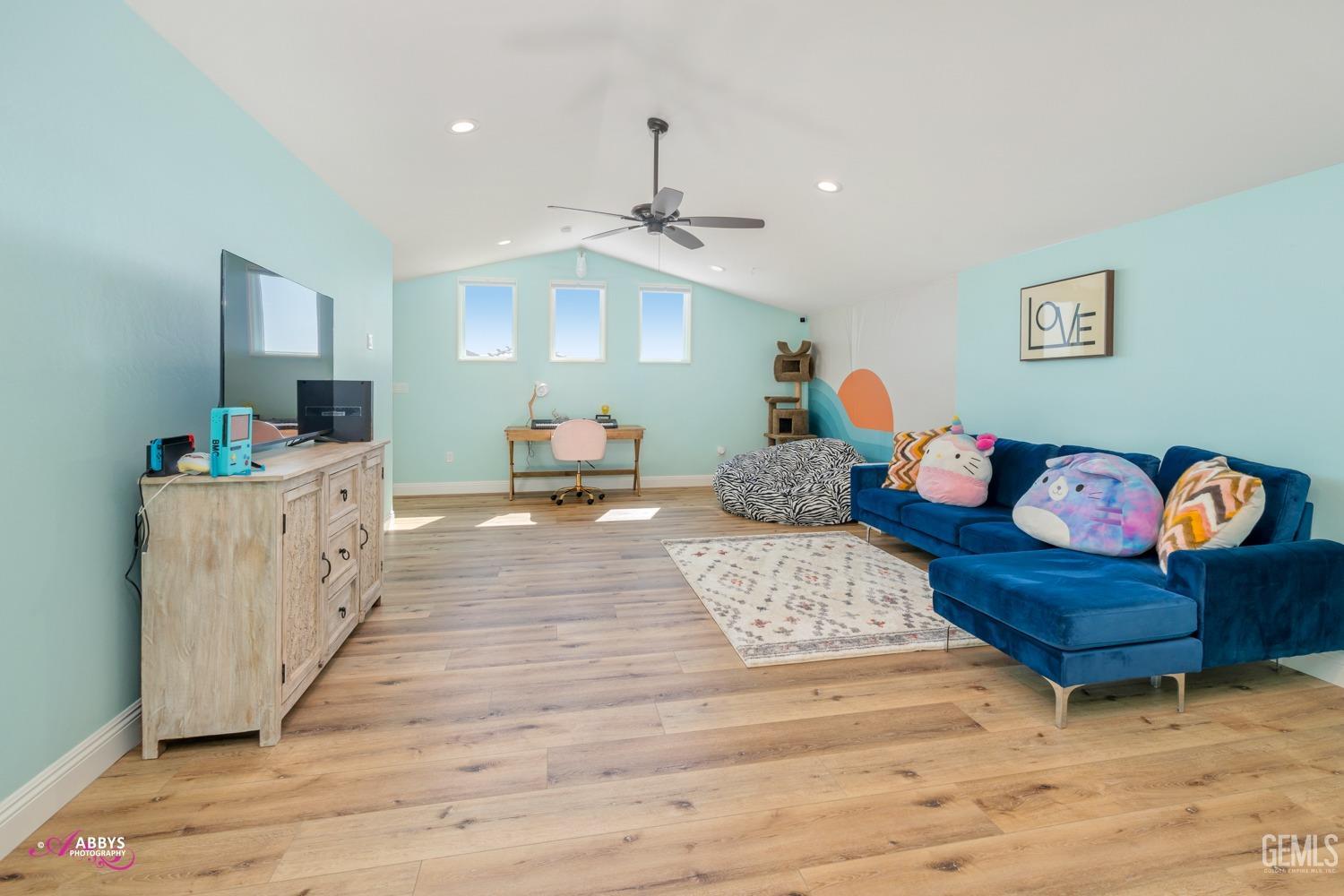 Undisclosed Address Bakersfield, CA 93314 - Photo 31 of 40 a bedroom with furniture and a wooden floor