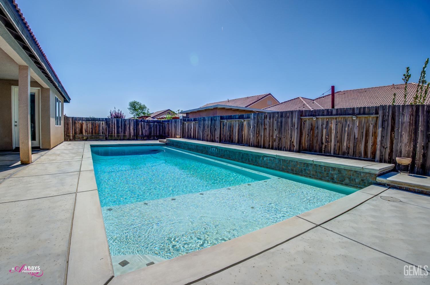 Undisclosed Address Bakersfield, CA 93314 - Photo 39 of 40 a view of a yard with wooden fence