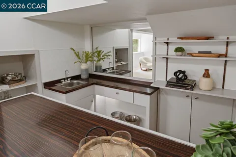 a kitchen with a sink and cabinets