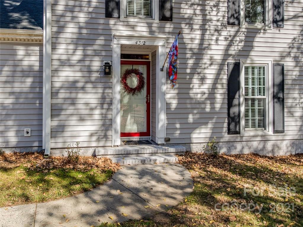4312 Truscott Road Charlotte, NC 28226 - Photo 2 of 31 a front view of a house with a yard