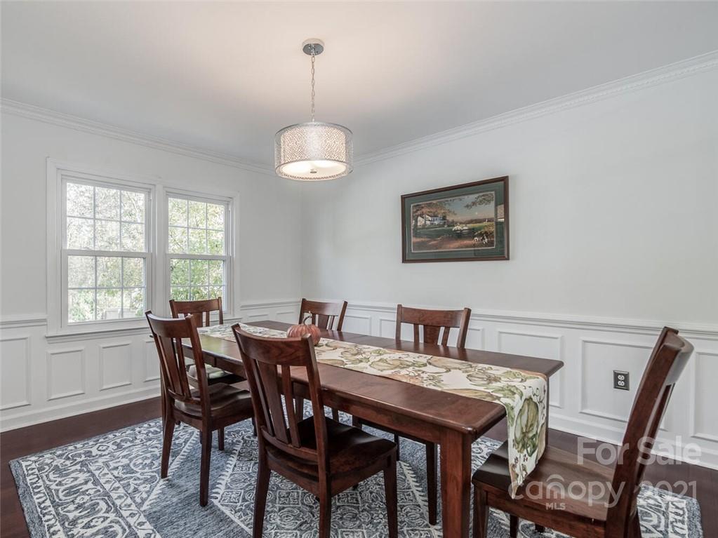 4312 Truscott Road Charlotte, NC 28226 - Photo 11 of 31 a view of a dining room with furniture window and wooden floor