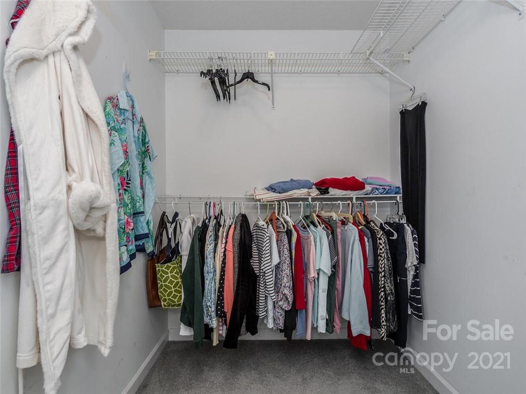 4312 Truscott Road Charlotte, NC 28226 - Photo 21 of 31 a view of walk in closet with clothes