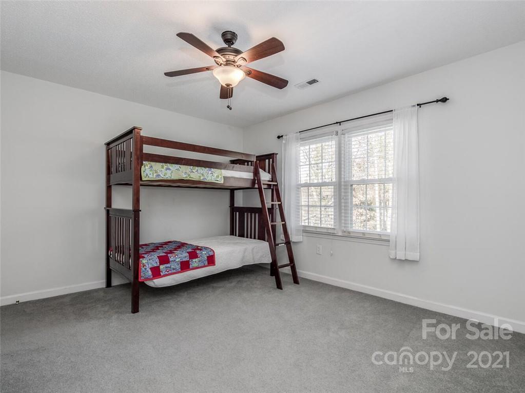 4312 Truscott Road Charlotte, NC 28226 - Photo 23 of 31 a bedroom with bed and window