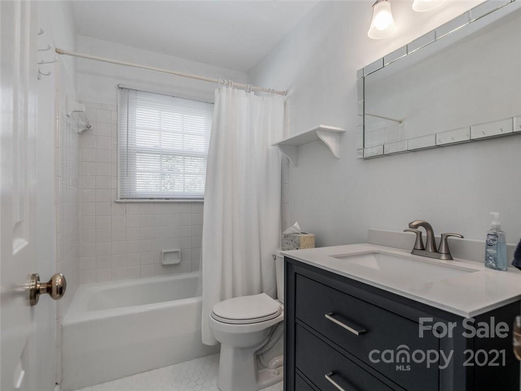 4312 Truscott Road Charlotte, NC 28226 - Photo 25 of 31 a bathroom with a sink a toilet and shower