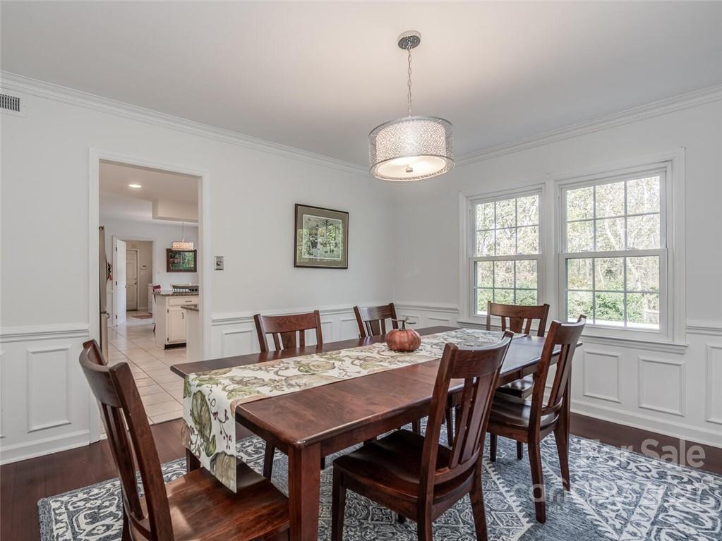 4312 Truscott Road Charlotte, NC 28226 - Photo 10 of 31 a view of a dining room with furniture window and wooden floor