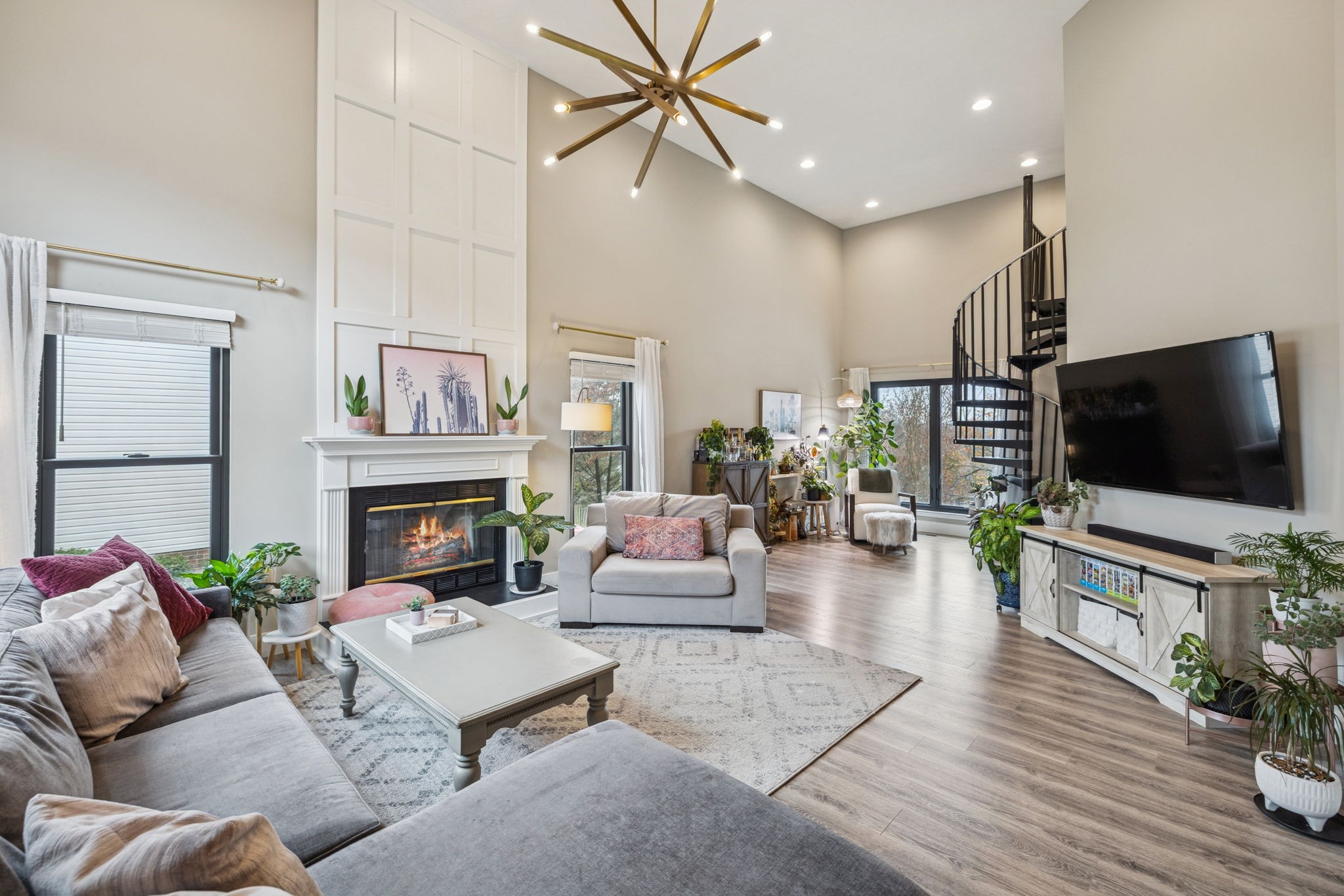 225 Burgandy Hill Road Nashville, TN 37211 - Photo 3 of 32 a living room with furniture a flat screen tv and a fireplace