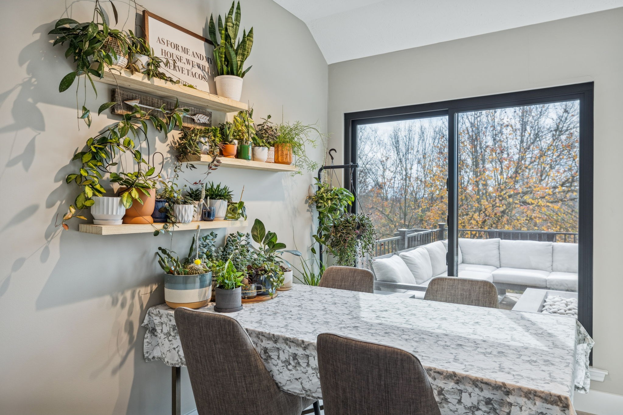 225 Burgandy Hill Road Nashville, TN 37211 - Photo 10 of 32 a view of a dining room with furniture a potted plant and a floor to ceiling window