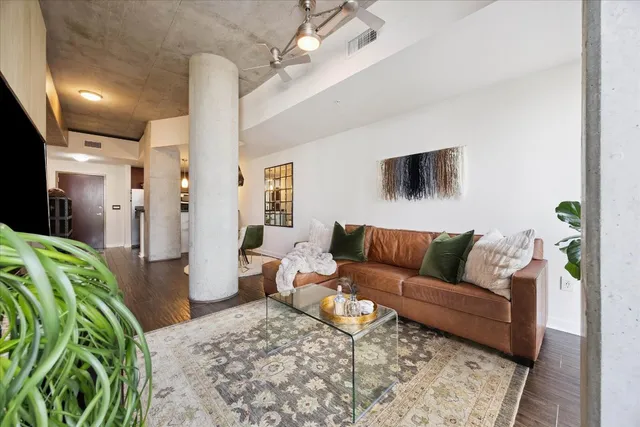 a living room with furniture and a flat screen tv