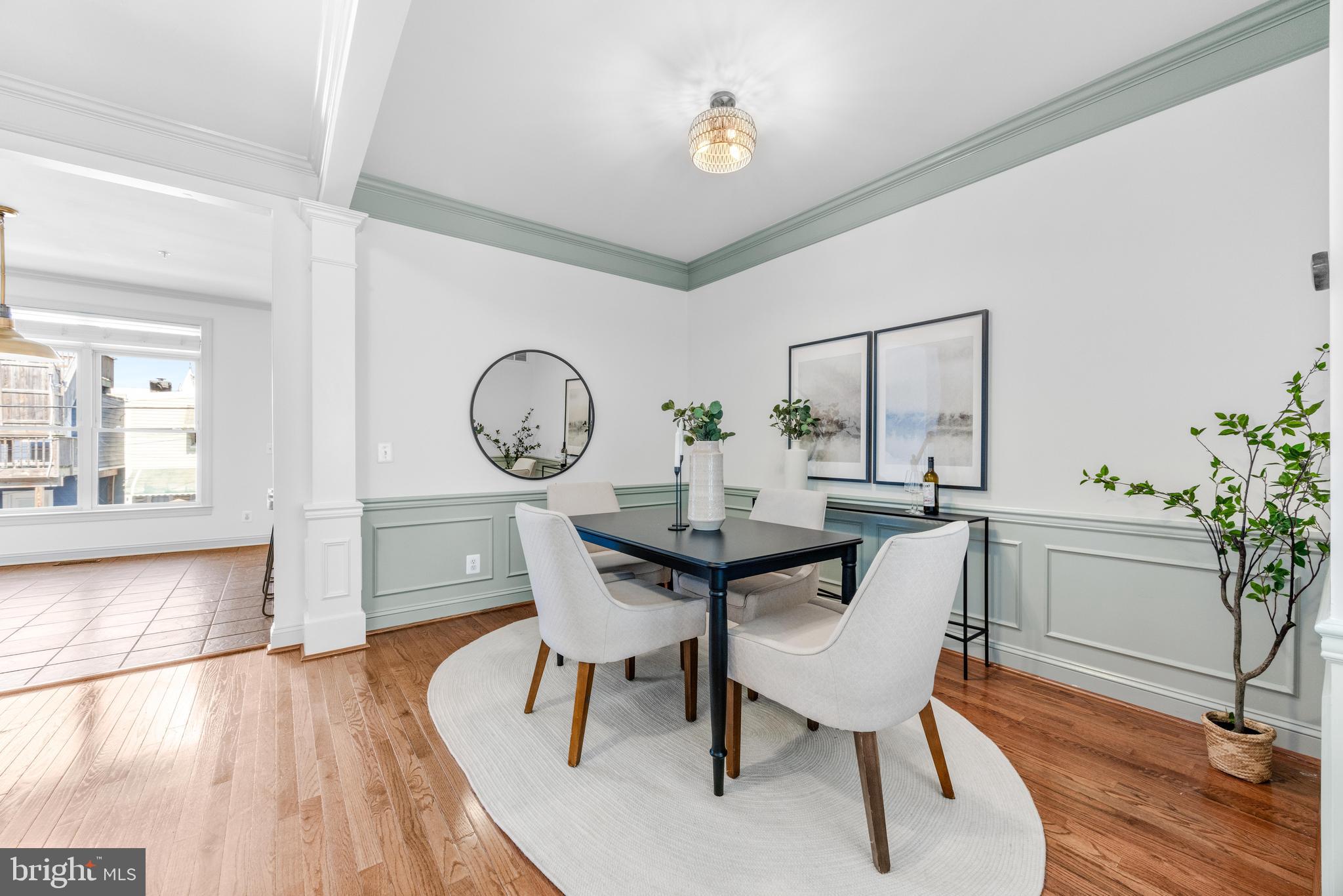 1436 Steuart Street Baltimore, MD 21230 - Photo 15 of 56 a view of a dining room with furniture and wooden floor
