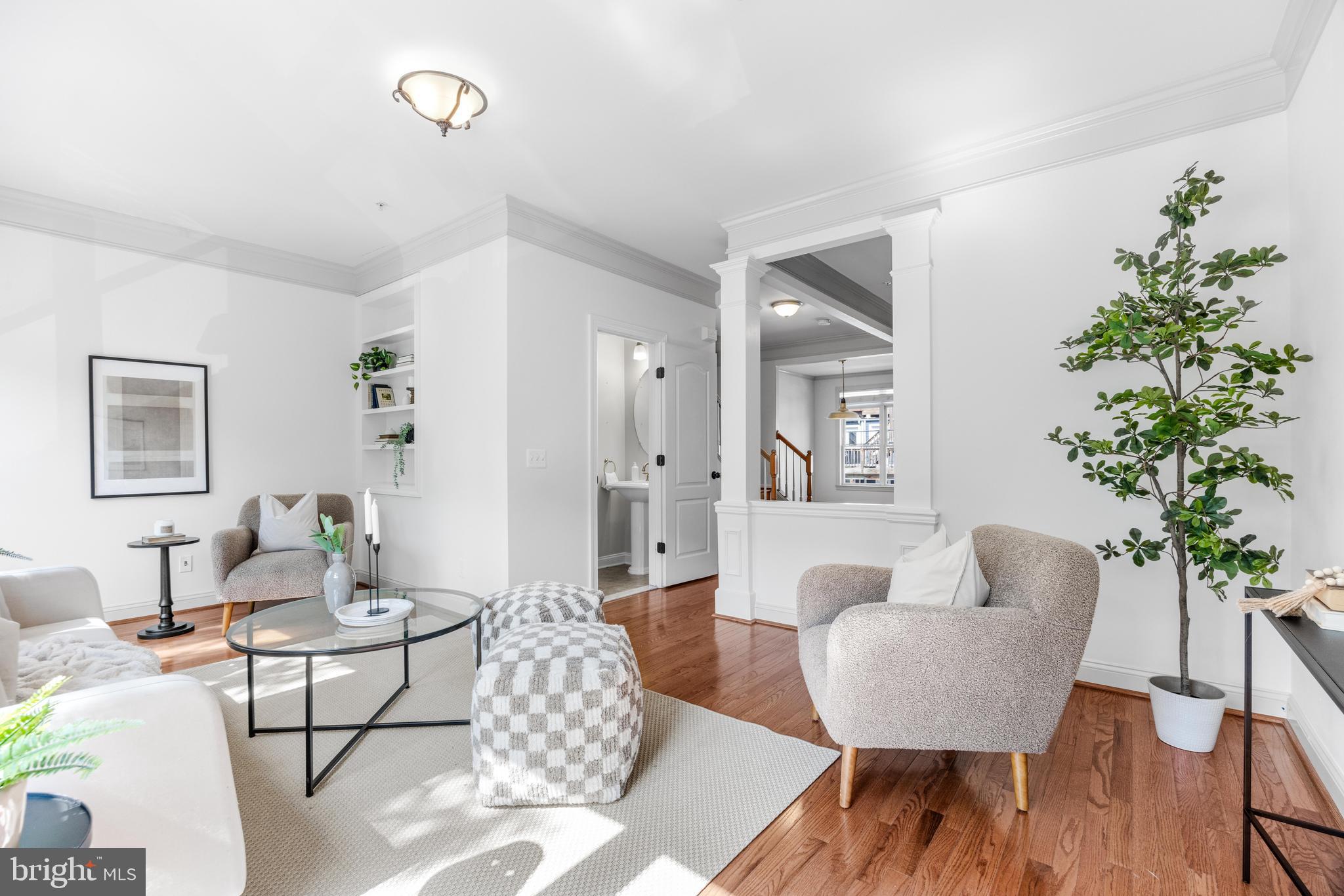 1436 Steuart Street Baltimore, MD 21230 - Photo 19 of 56 a living room with furniture and a potted plant