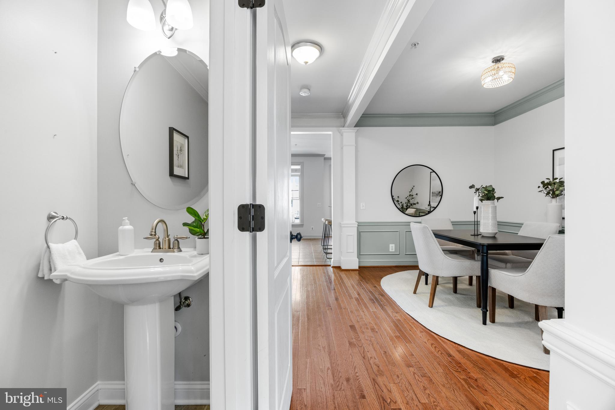 1436 Steuart Street Baltimore, MD 21230 - Photo 22 of 56 a view of a dining room with furniture and wooden floor