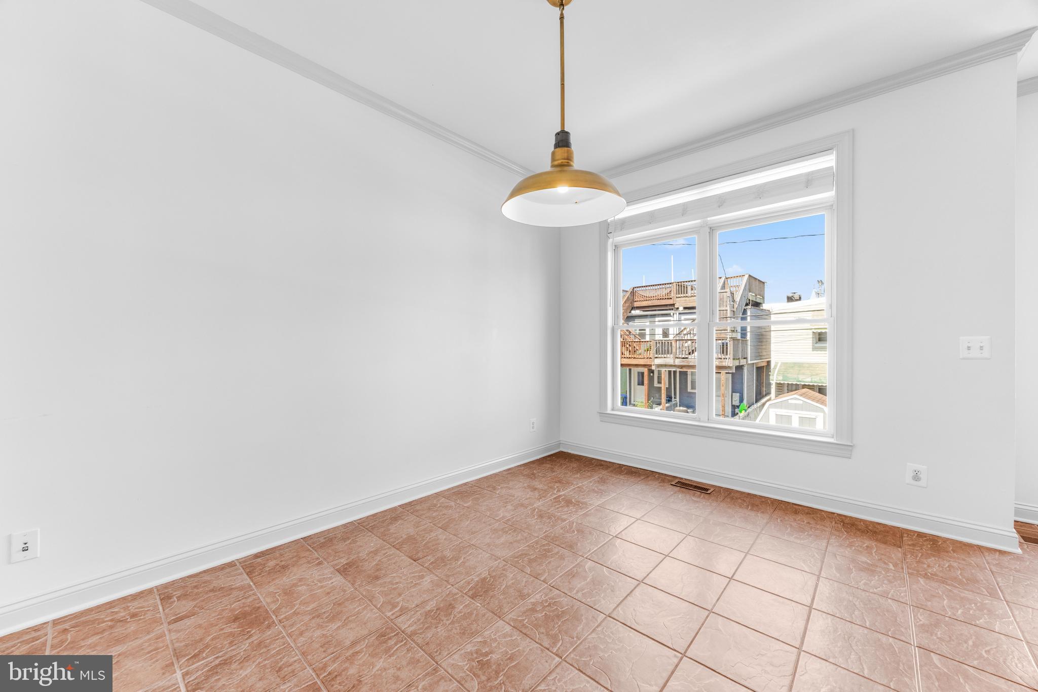 1436 Steuart Street Baltimore, MD 21230 - Photo 25 of 56 a view of an empty room with a window