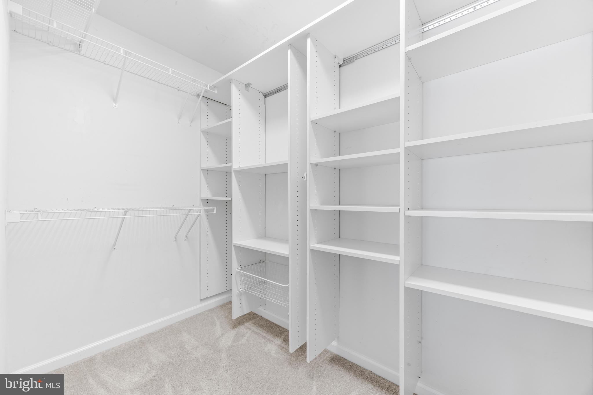 1436 Steuart Street Baltimore, MD 21230 - Photo 39 of 56 a view of walk in closet with empty racks