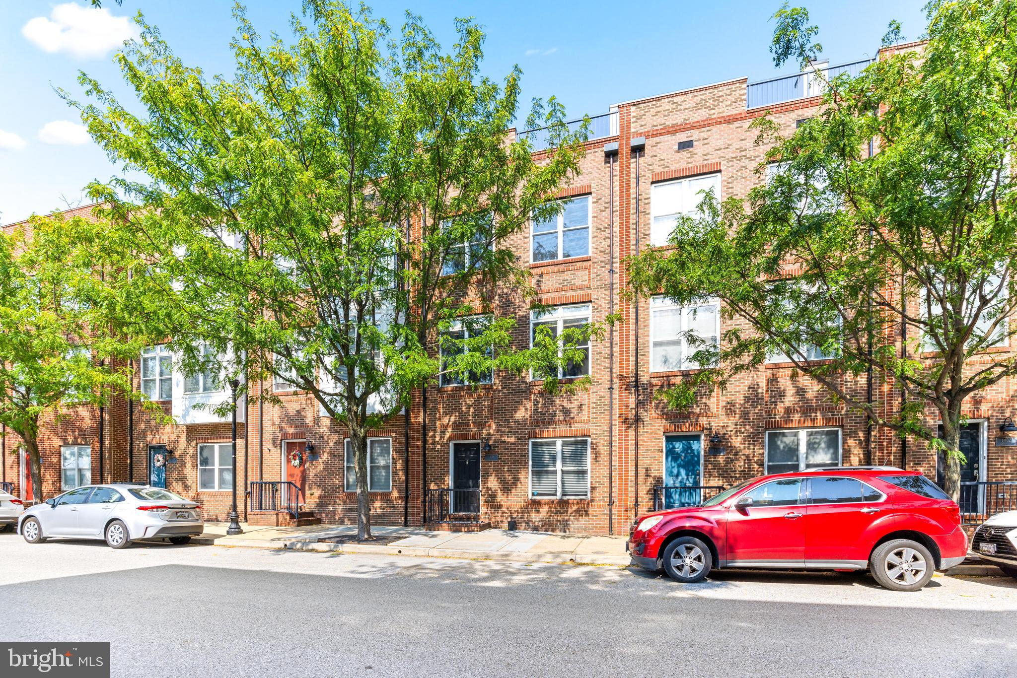 1436 Steuart Street Baltimore, MD 21230 - Photo 56 of 56 a red car parked in front of a building