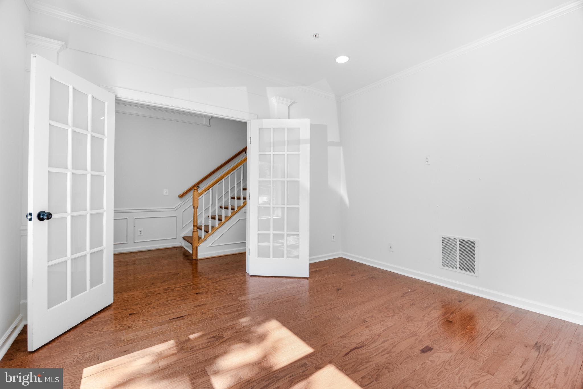 1436 Steuart Street Baltimore, MD 21230 - Photo 9 of 56 a view of entryway with stairs and wooden floor