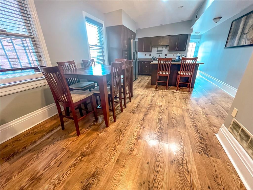 2414 East Carson Street, Unit 2 Pittsburgh, PA 15203 - Photo 5 of 15 a dining room with furniture and wooden floor